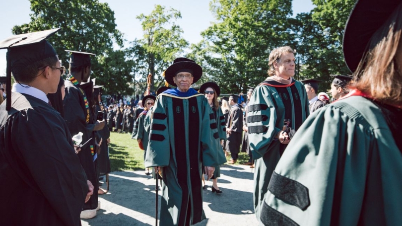 At center, Trustee James Jackson marches with Trustee Jeffrey Blackburn '91 during last year's commencement ceremony.
